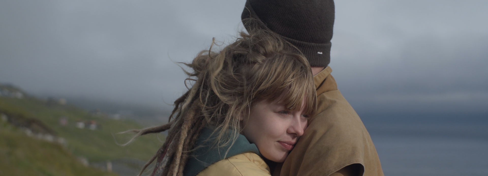 Two people in nature hugging